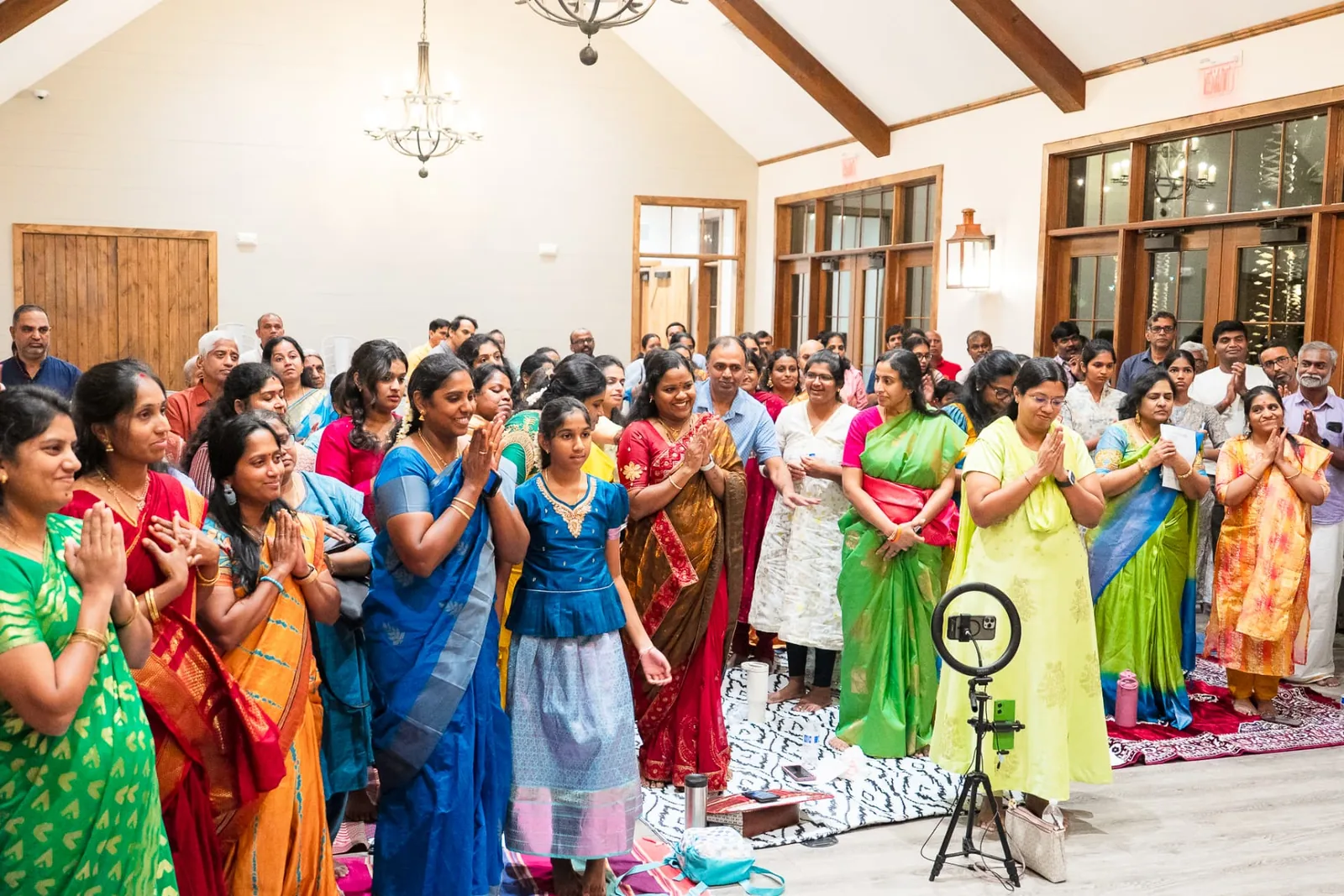Devotees standing together in prayer and recitation